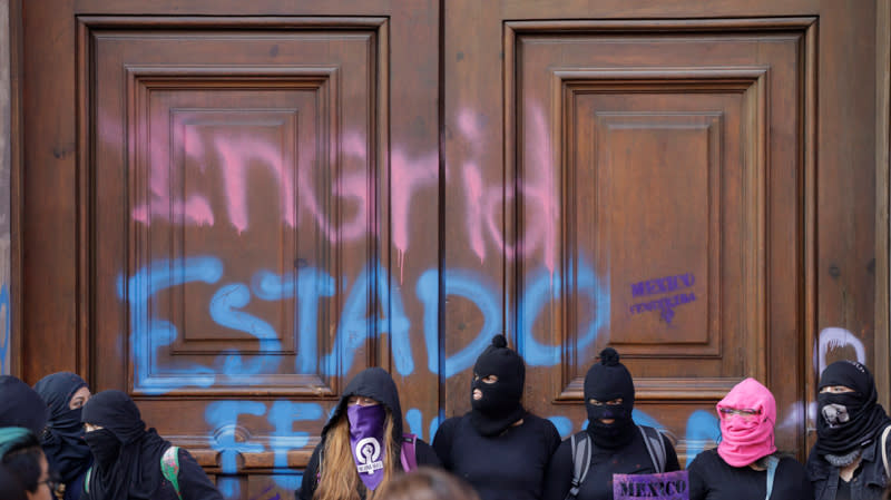 People take part in a protest against gender-based violence in downtown of Mexico City