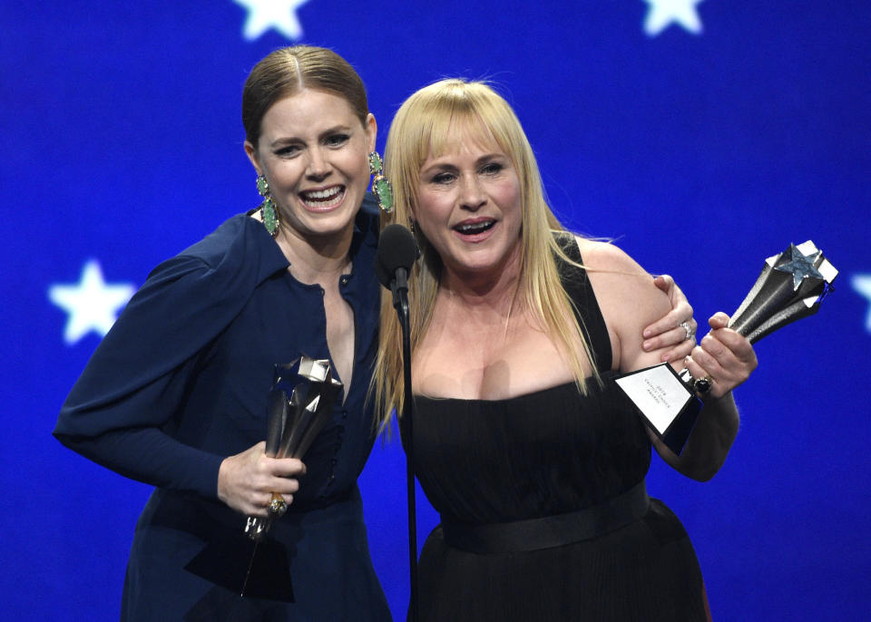 Amy Adams, left, and Patricia Arquette accept the award, a tie, for best actress in a limited series or movie made for television at the 24th annual Critics’ Choice Awards on Sunday, Jan. 13, 2019, at the Barker Hangar in Santa Monica, Calif. Adams won for her role in “Sharp Objects” and Arquette won for her role in “Escape at Dannemora.” (Photo by Chris Pizzello/Invision/AP