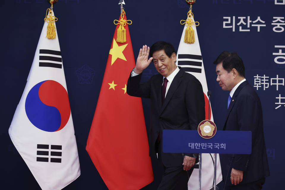 China's National People's Congress (NPC) Standing Committee Chairman Li Zhanshu, left, and South Korea's National Assembly Speaker Kim Jin Pyo leave after a joint news conference at the National Assembly in Seoul, South Korea Friday, Sept. 16, 2022. (Kim Hong-Ji/Pool Photo via AP)