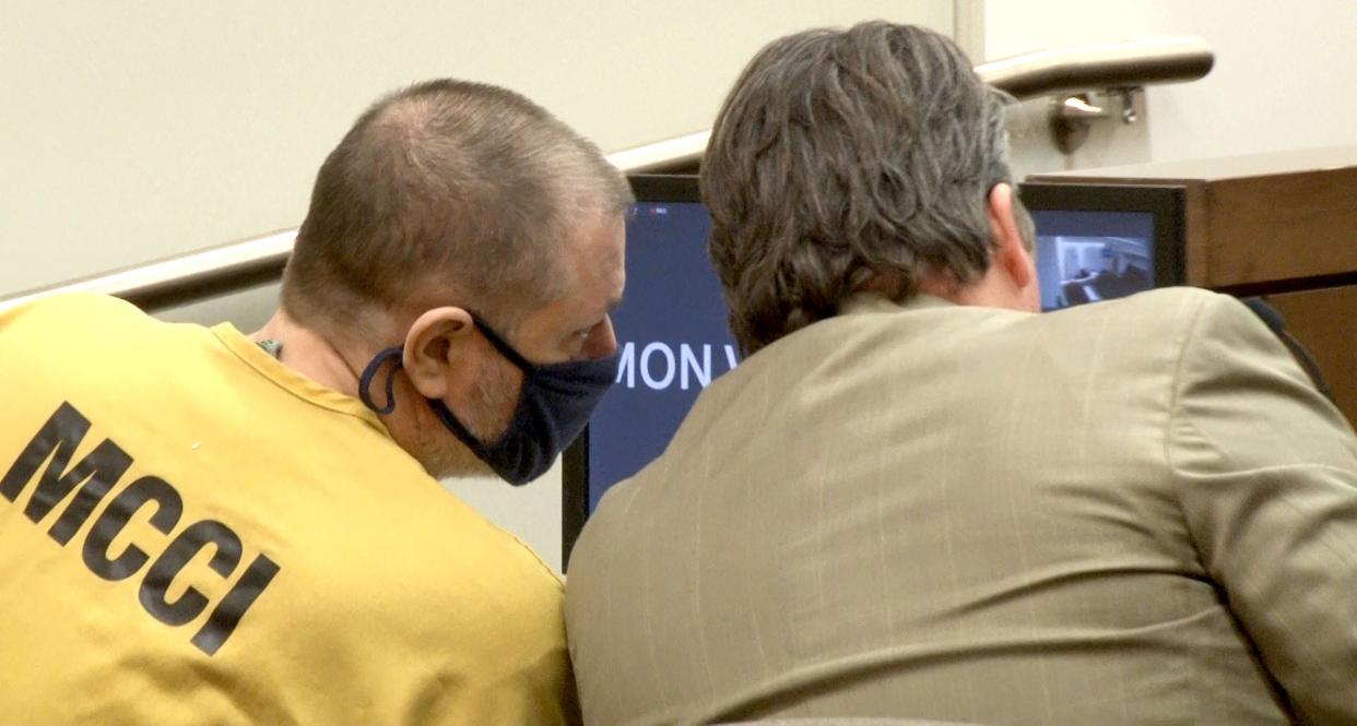 Paul Caneiro leans in to speak with his attorney during a hearing before Superior Court Judge Joseph W. Oxley at the Monmouth County Courthouse in Freehold Tuesday, October 31, 2023.