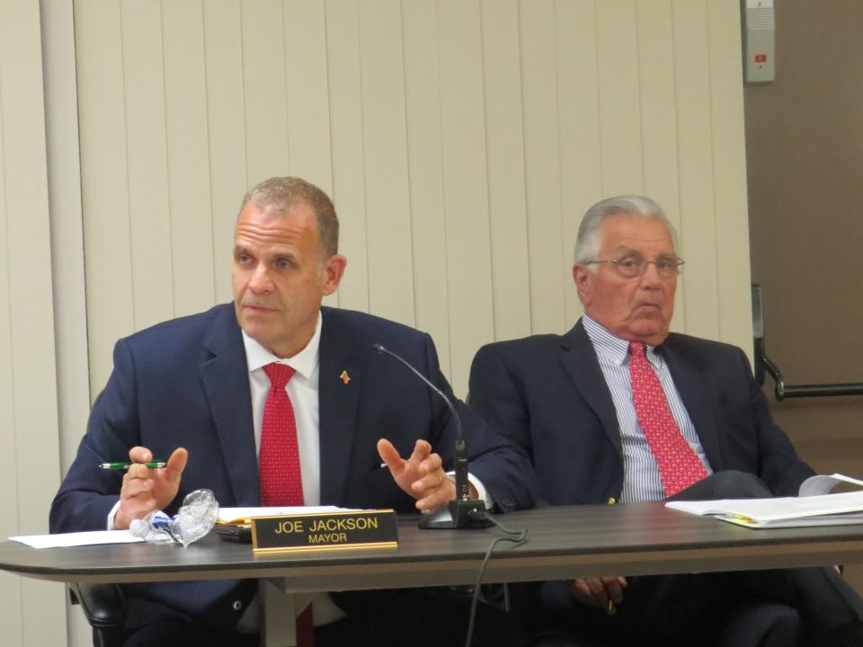 Rockaway Township Mayor Joseph Jackson, left, speaks about stalled contract negotiations during Tuesday's council meeting. With him is township attorney John Iachiofano.