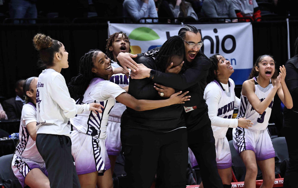 Africentric players and coaches react after beating Ottawa-Glandorf for the Division III state championship Saturday.