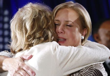 Democratic Senator Mary Landrieu (R) hugs a supporter after delivering a concession speech after the results of the U.S. Senate race in Louisiana during a runoff in New Orleans, Louisiana, December 6, 2014. REUTERS/Jonathan Bachman