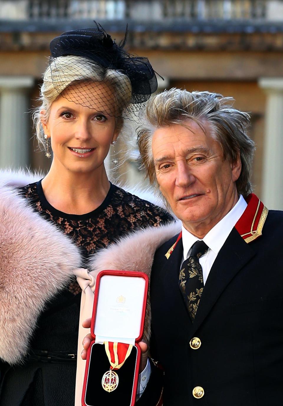 Sir Rod Stewart at Buckingham Palace with Penny Lancaster after he received his knighthood in recognition of his services to music and charity (Gareth Fuller/PA) (PA Archive)