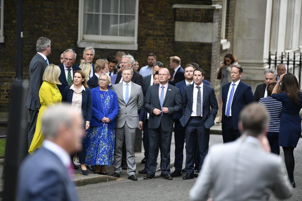 People watch as Prime Minister Boris Johnson reads a statement outside 10 Downing Street, London, formally resigning as Conservative Party leader after ministers and MPs made clear his position was untenable. He will remain as Prime Minister until a successor is in place. Picture date: Thursday July 7, 2022. (PA Wire)