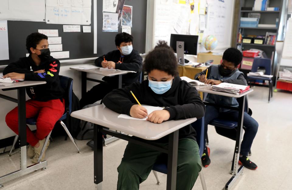 Students in Paula Johnson's 6th grade English Class at Yonkers Middle High School in Yonkers, New York, wear face coverings during class, Feb. 17, 2022. 
