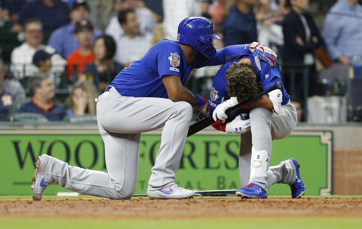 HOUSTON, TEXAS - MAY 29: Albert Almora Jr. #5 of the Chicago Cubs is comforted by Jason Heyward #22 after a young child was injured by a foul ball off his bat in the fourth inning against the Houston Astros at Minute Maid Park on May 29, 2019 in Houston, Texas. (Photo by Bob Levey/Getty Images)