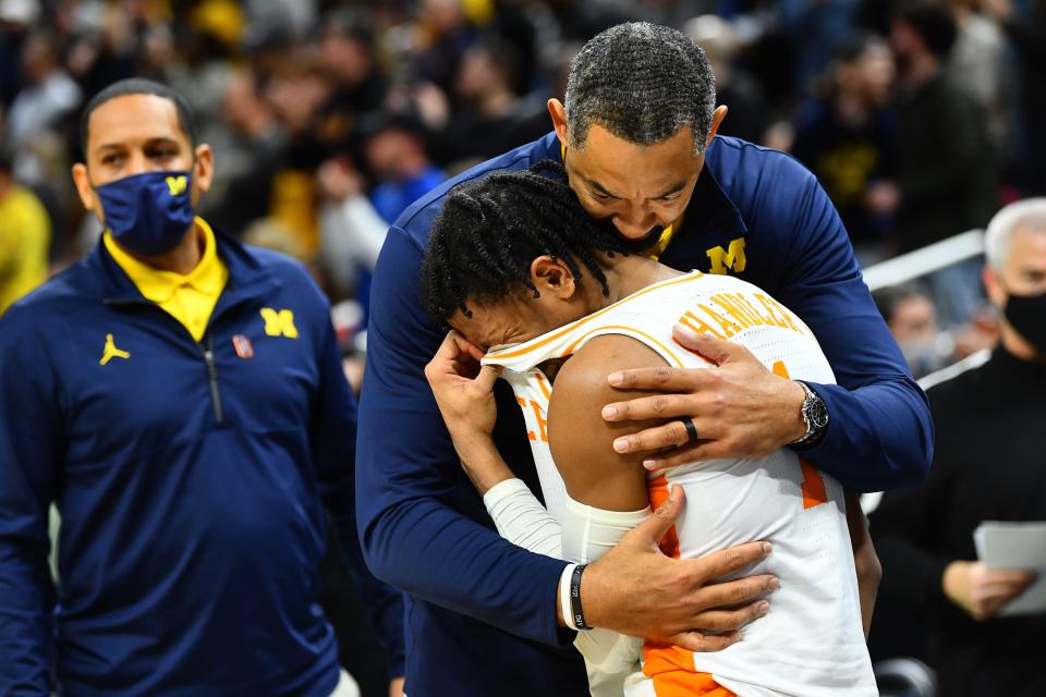 In this award-winning photo by Knox News' Brianna Paciorka, Tennessee guard Kennedy Chandler sobs in the arms of Michigan head coach Juwan Howard after the NCAA Tournament second round game between Tennessee and Michigan at Gainbridge Fieldhouse in Indianapolis on March 19, 2022.