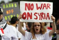 Syrian-American demonstrator Rose Ahmad chants against possible U.S. military intervention in the conflict in Syria as a group of Syrian-Americans protest in front of the White House in Washington, September 9, 2013. REUTERS/Jim Bourg