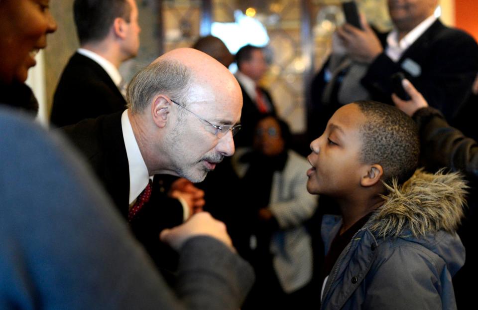 Governor Tom Wolf listens to 9-year-old Ohani Gaymon of Harrisburg during an open house at the governor's residence in Harrisburg Tuesday, January 20, 2015. Governor Tom Wolf and his wife hosted the event after the inauguration ceremony that morning.