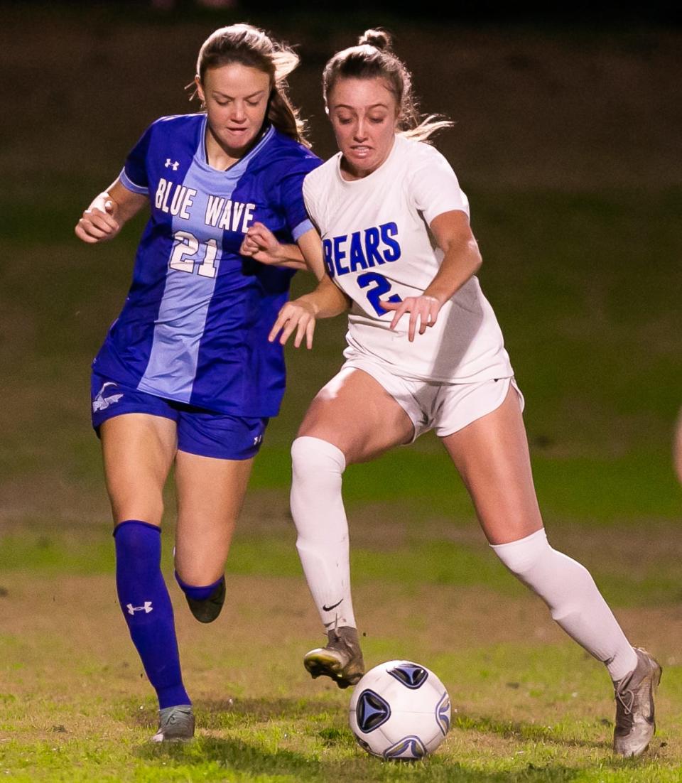 P. K. Yonge Blue Wave Emma Mansfield (21) and Bartram Trail Bears midfielder Grace Ivey (2) battle for control of the ball. P.K. Yonge hosted Bartram Trail in girls soccer at P.K Yonge High School in Gainesville, FL., Tuesday night, January 3, 2023. Bartram Trail lead 4-0 at the half.  [Doug Engle/Gainesville Sun]2023