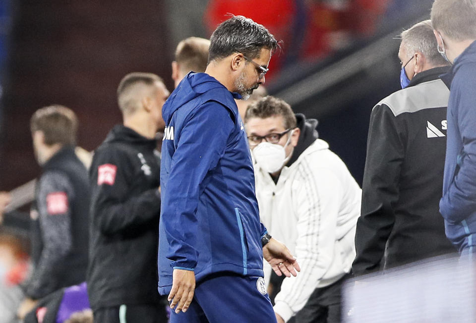 Schalke's head coach David Wagner leaves the pitch after his last match as Schalke head coach after losing the German Bundesliga soccer match between FC Schalke 04 and Werder Bremen in Gelsenkirchen, Germany, Saturday, Sept. 26, 2020. Schalke dismissed Wagner today after a series of 18 consecutive winless matches. (AP Photo/Martin Meissner)