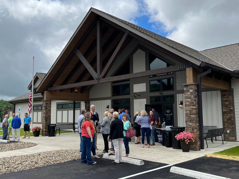 Visitors gather in front of the newly renovated Tappan Lake Marina in Harrison County on Friday.