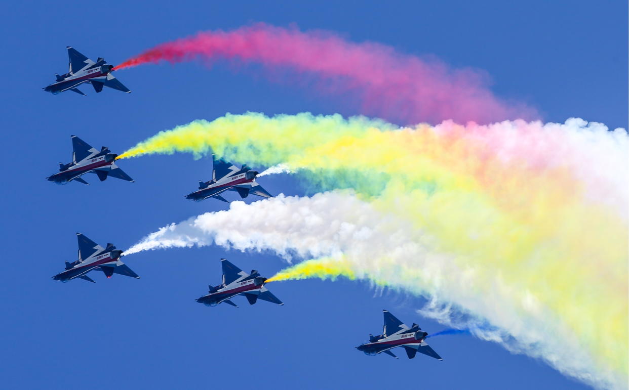 Chengdu J-10 fighter aircraft of the Chinese aerobatic team August 1st, or Ba Yi, release colourful smoke during a demonstration flight as part of the Army 2018 International Military and Technical Forum. (PHOTO: TASS via Getty Images)