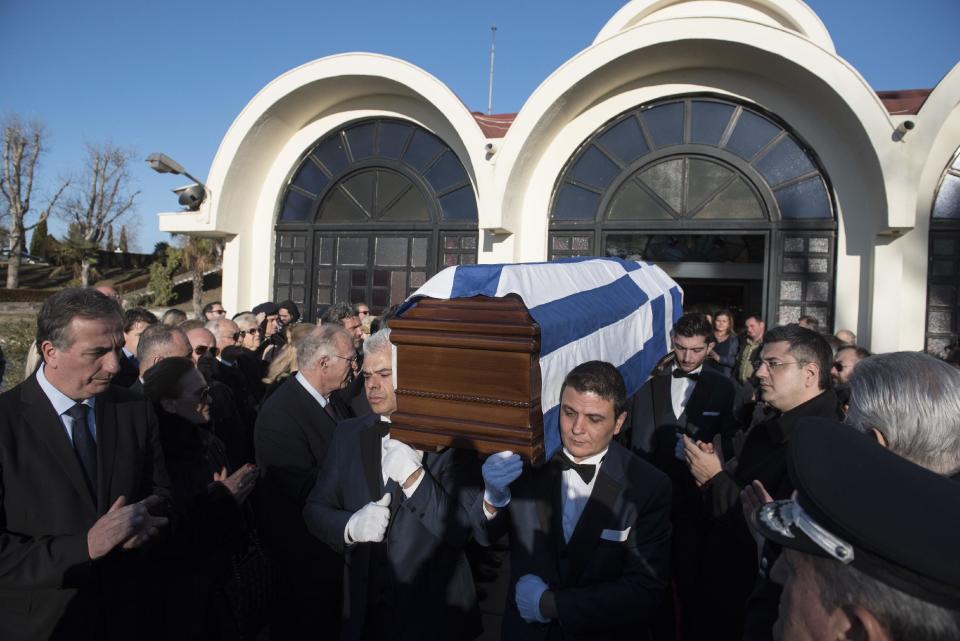 The coffin of late Greek Ambassador to Brazil Kyriakos Amiridis is carried out of a church during a funeral procession, at the northern Greek city of Thessaloniki, Sunday, Jan. 15, 2017. Police have said they believe Amiridis, whose charred body was found in a car in Brazil, was killed by his wife's lover under her orders. (AP Photo/Giannis Papanikos)