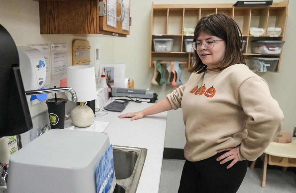 Day Early Learning teacher Eileen O'Connor cleans the counter top Wednesday, Nov. 1, 2023, at Day Early Learning at T.C. Howe Middle School in Indianapolis.