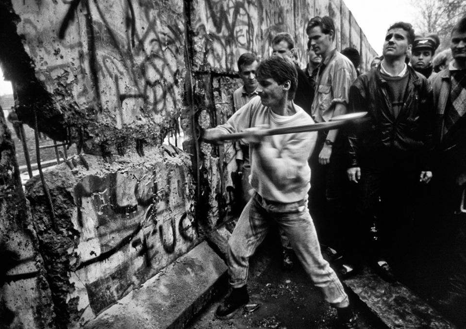 The first section of the Berlin Wall is torn down by crowds on November 10, 1989 (Tom Stoddart)