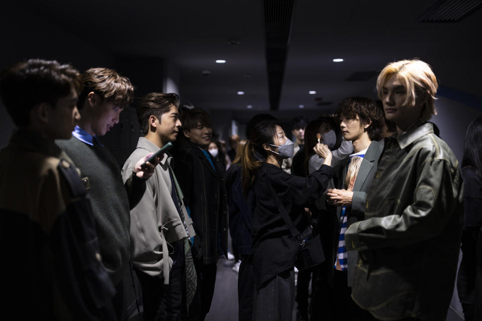 Cantopopboy bandMirror prepares before an interview with The Associated Press in Hong Kong on Sunday, March 12, 2023. Hong Kong's most popular boy band Mirror, a major driving force behind the revival of the local pop music scene, launched its first English song on Friday, hoping to bring the city's tunes to music lovers globally. (AP Photo/Louise Delmotte)