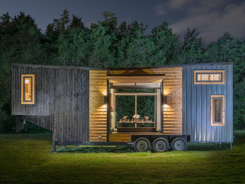 a two-level tiny home with dining room