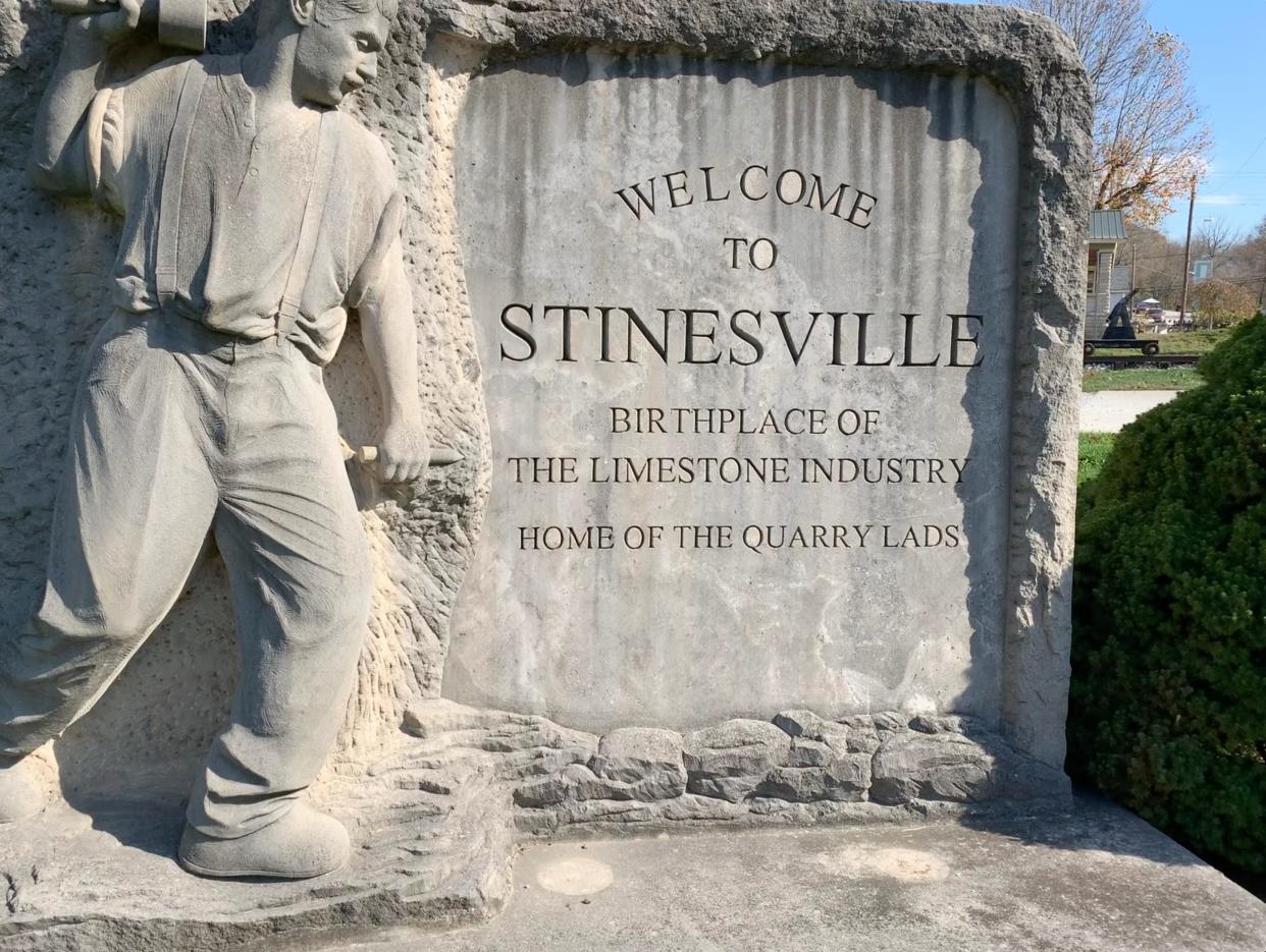 A limestone monument marking the entrance to Stinesville.