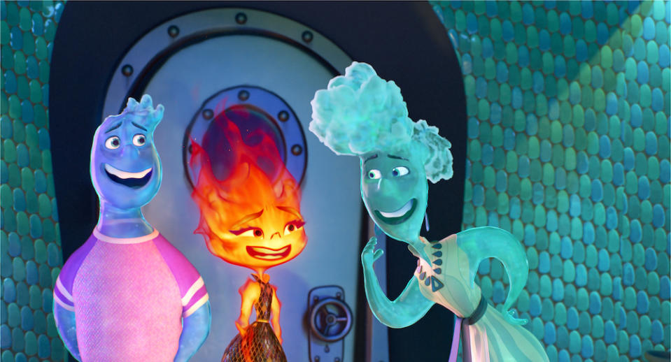 Go-with-the-flow guy Wade (Mamoudou Athie) introduces fiery young woman Ember (voice of Leah Lewis) to his mom, Brook (voice of Catherine O’Hara) in Elemental. (STILL: Disney/Pixar