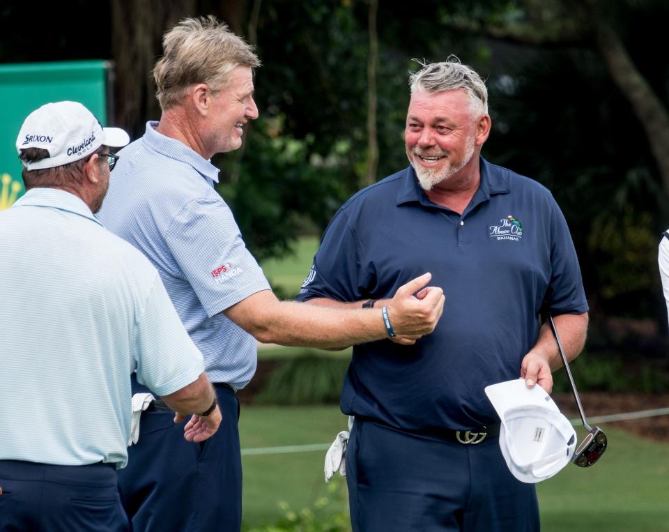 Ernie Els, left, congratulates Darren Clarke at last year's TimberTech Championship at The Old Course at Broken Sound in Boca Raton, Florida on October 31, 2020.   [RICHARD GRAULICH/palmbeachpost.com]
