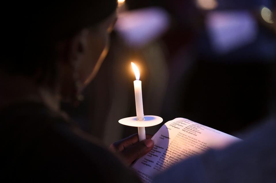 Pastor Richard Cox, of Trinity Lutheran Church, leads a prayer vigil at the corner of North 13th Street and Avenue M on Tuesday, Jan. 17, 2023, for the victims of Monday's mass shooting during a Martin Luther King Jr. Day celebration and car show on Monday at Ilous Ellis Park in Fort Pierce. "We're out here to demonstrate  support that the people involved are members of our community too and that we love them and we're praying for swift healing for those in the hospital and our prayers are with those who lost loved ones yesterday," Pastor Cox said.