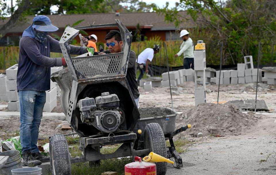 Construction workers build the outer walls of Marilynn Distefano’s home, which was destroyed by Hurricane Irma in 2017 and is part of the state’s Rebuild Florida program.