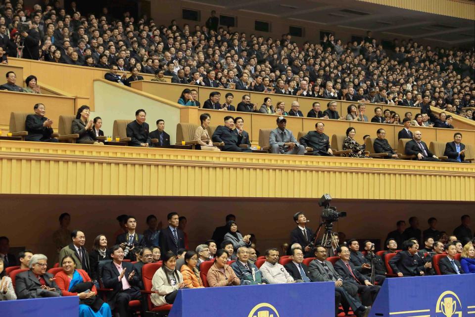 North Korean leader Kim Jong Un watches a basketball game between former U.S. NBA basketball players and North Korean players of the Hwaebul team of the DPRK with Dennis Rodman at Pyongyang Indoor Stadium