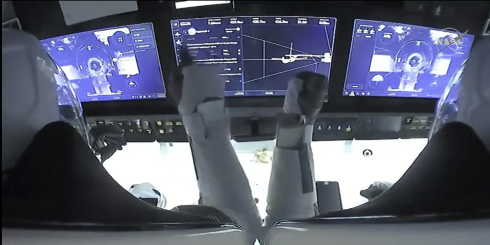 Image: SpaceX Crew Docks (NASA TV via AP)