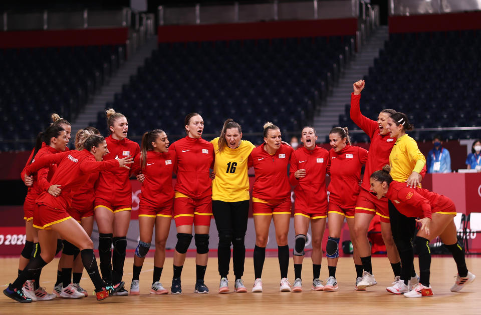 <p>Team Montenegro cheer after their national anthem ahead of the Women's Preliminary Round Group A handball match between Montenegro and South Korea on day eight of the Tokyo 2020 Olympic Games at Yoyogi National Stadium on July 31, 2021 in Tokyo, Japan. (Photo by Dean Mouhtaropoulos/Getty Images)</p> 