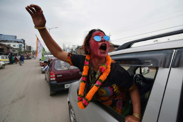 A supporter of National People's Party candidate Y. Joykumar shouts as she celebrates his win in the Uripok constituency in Imphal, Assam state