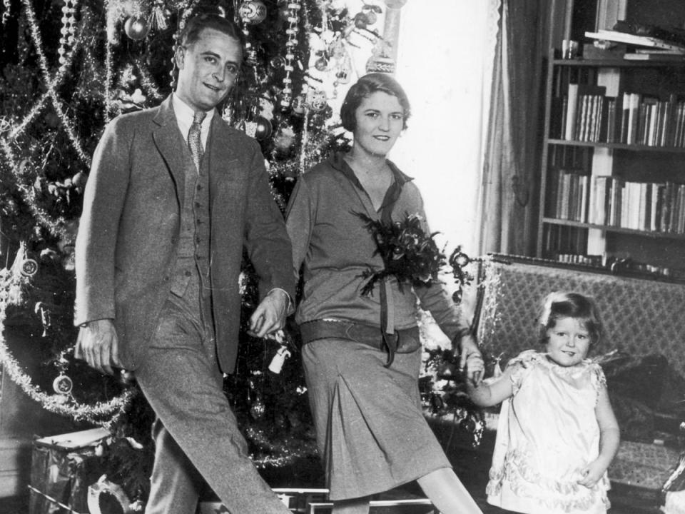 F Scott, Zelda and Frances ‘Scottie’ Fitzgerald dance in front of a Christmas tree in Paris (Getty)