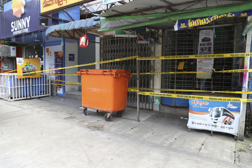 A lockdown building wrapped with yellow police sits shuttered due to the coronavirus in Yangon, Myanmar, Thursday, Sept. 10, 2020. Myanmar is accelerating efforts to control the spread of the coronavirus, which now has impinged on the upcoming November 8 general election, as campaigning has been ordered suspended in several areas locked down to control the spread of the virus. (AP Photo/Thein Zaw)