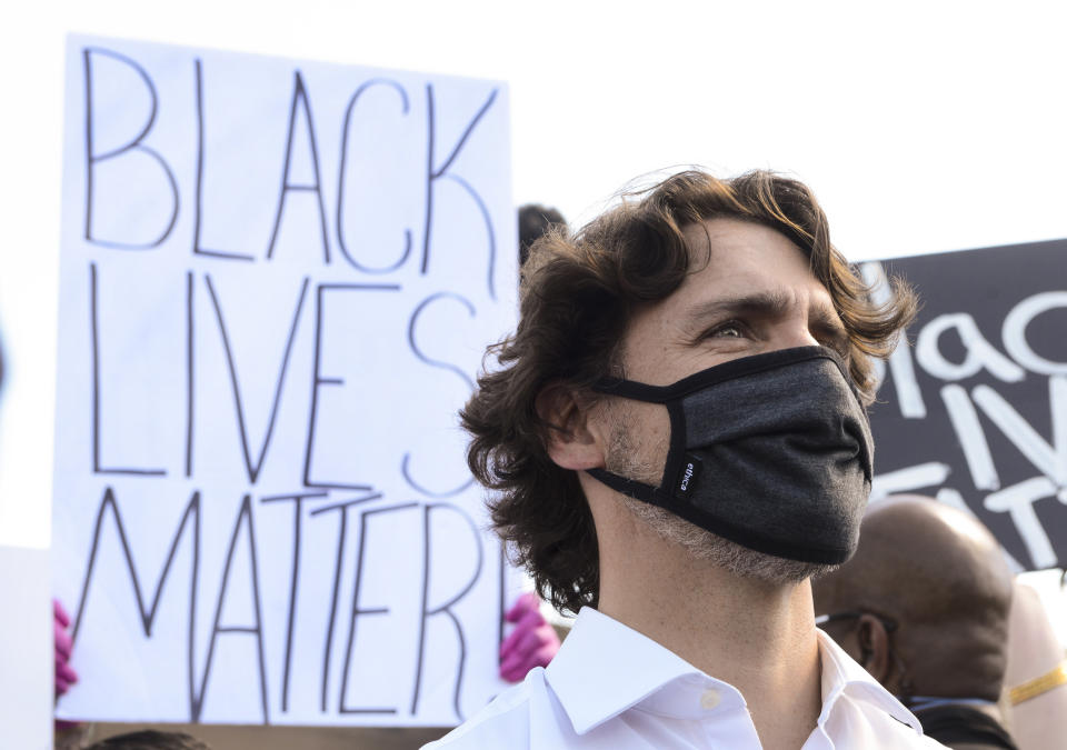 Prime Minister Justin Trudeau takes takes part in an anti-racism protest on Parliament Hill during the COVID-19 pandemic in Ottawa, Friday, June 5, 2020. The death of George Floyd, a black man who died after he was restrained by Minneapolis police officers on May 25 has ignited protests in the U.S. and worldwide over racial injustice and police brutality. (Sean Kilpatrick/The Canadian Press via AP)