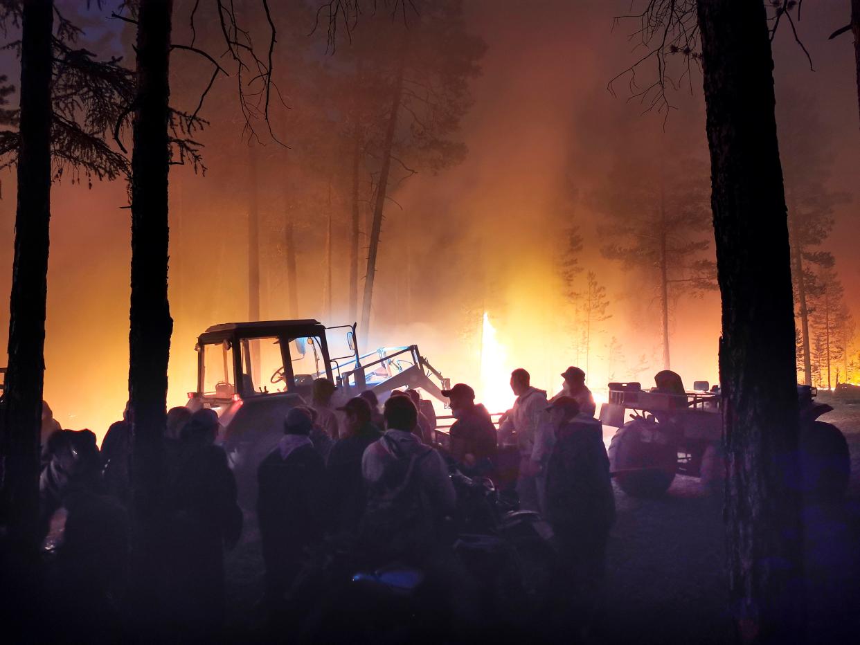 Volunteers prepare to douse a forest fire in the republic of Sakha also known as Yakutia, Russia Far East (AP)