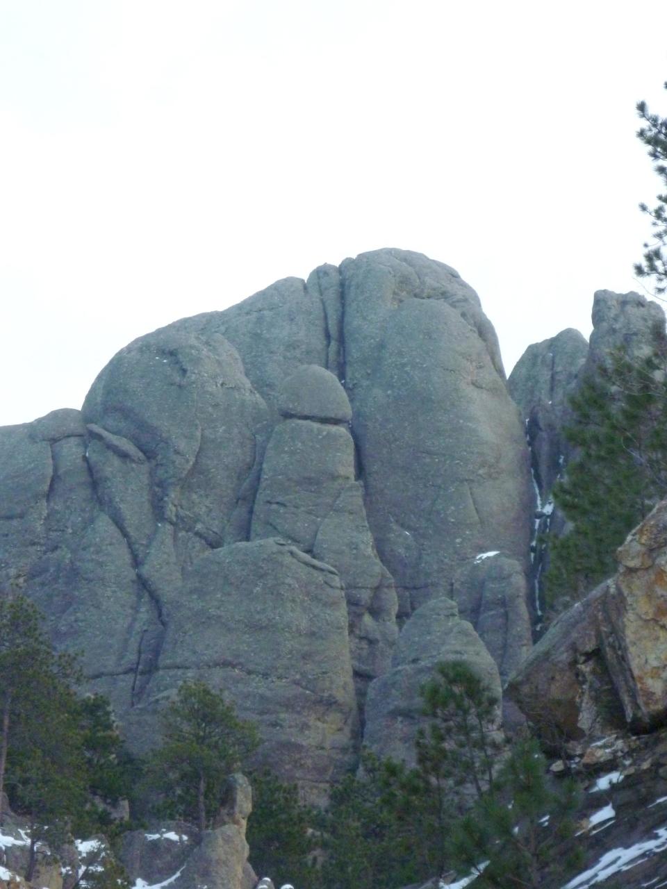 A phallic rock formation among the other rocks