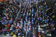 Pro-democracy protesters gather during a protest in Bangkok, Thailand, Saturday, Oct. 17, 2020. The authorities in Bangkok shut down mass transit systems and set up roadblocks Saturday as Thailand capital faced a fourth straight day of determined anti-government protests. (AP Photo/Sakchai Lalit)