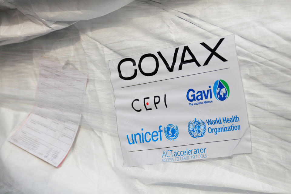 Image: The first batch of AstraZeneca-Oxford vaccines arrives in Accra, Ghana, this week as part of the COVAX program. (Francis Kokoroko / Reuters)