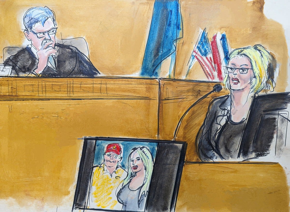 In this courtroom sketch, Stormy Daniels testifies on the witness stand as Judge Juan Merchan looks on in Manhattan criminal court on 7 May 2024 (AP)