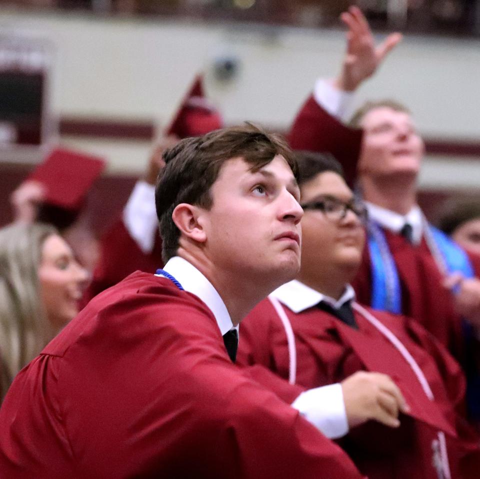 Eagleville graduate Jake Baehr tosses his cap into air at the close of Eagleville's graduation ceremony on Friday, May 12, 2023, at the school.