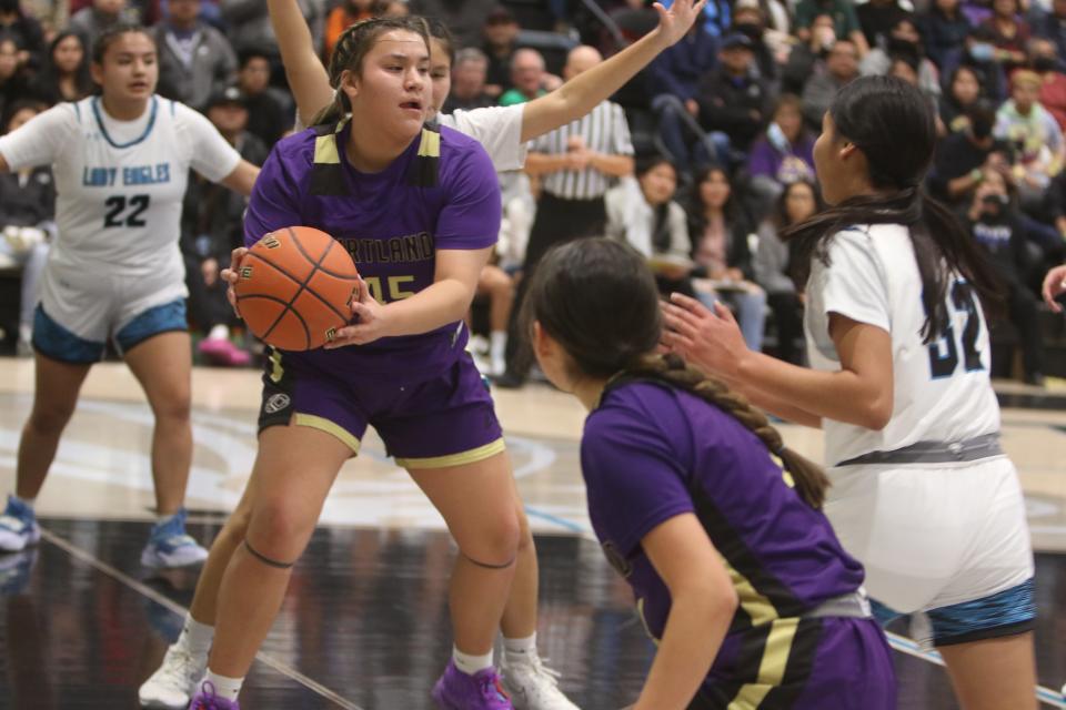 Kirtland Central's Keira Beall-Gleason tries to get to the basket during the first quarter of a basketball game against Navajo Prep, Tuesday, Dec. 20, 2022 at the Eagles Nest.