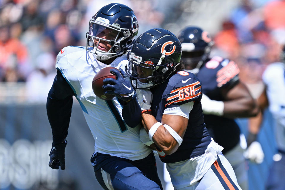 Aug 12, 2023; Chicago, Illinois, USA; Chicago Bears defensive back Kyler Gordon (6) tackles Tennessee Titans wide receiver Chris Moore (11) in the first quarter at Soldier Field. Mandatory Credit: Jamie Sabau-USA TODAY Sports