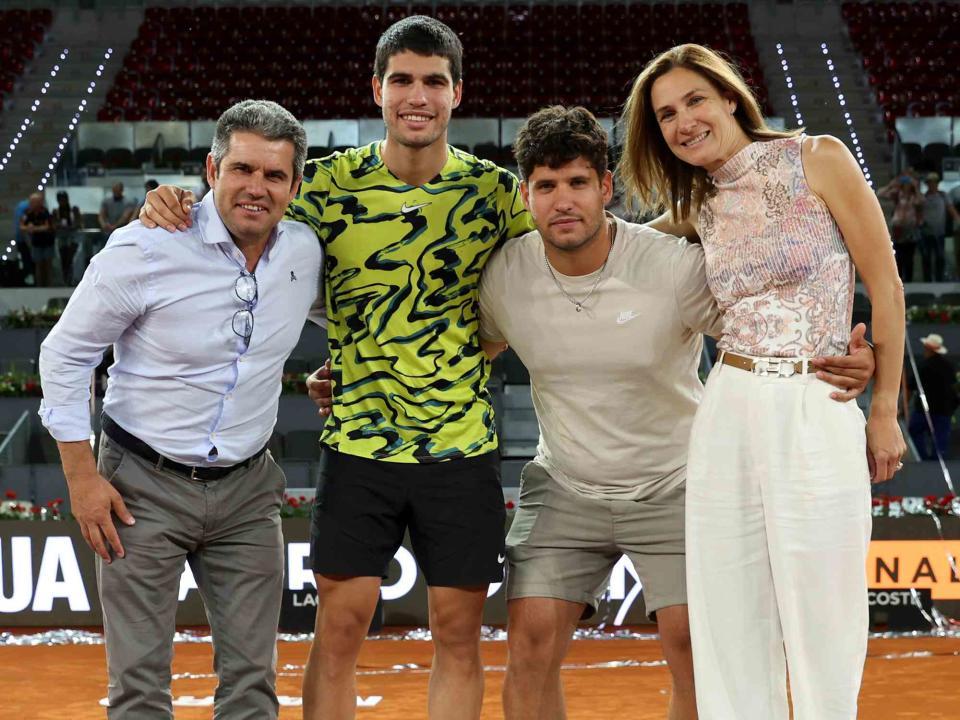 <p>Clive Brunskill/Getty</p> Carlos Alcaraz of Spain with his father Carlos Snr, his mother Virginia Garfia and brother Alvaro Alcaraz at the the Mutua Madrid Open in 2023