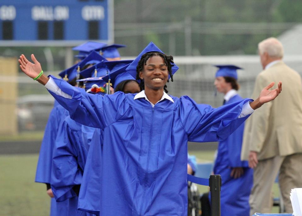 Mikarlem Saint-Louis celebrates during the Blue Hills Regional Technical School graduation in Canton, Tuesday, June, 6, 2023.