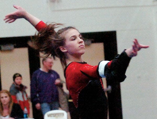 Deuel High School standout Meaghan Sievers is shown competingin the floor exercise during the 2012 Watertown Invitational gymnastics meet in the Watertown Civic Arena.