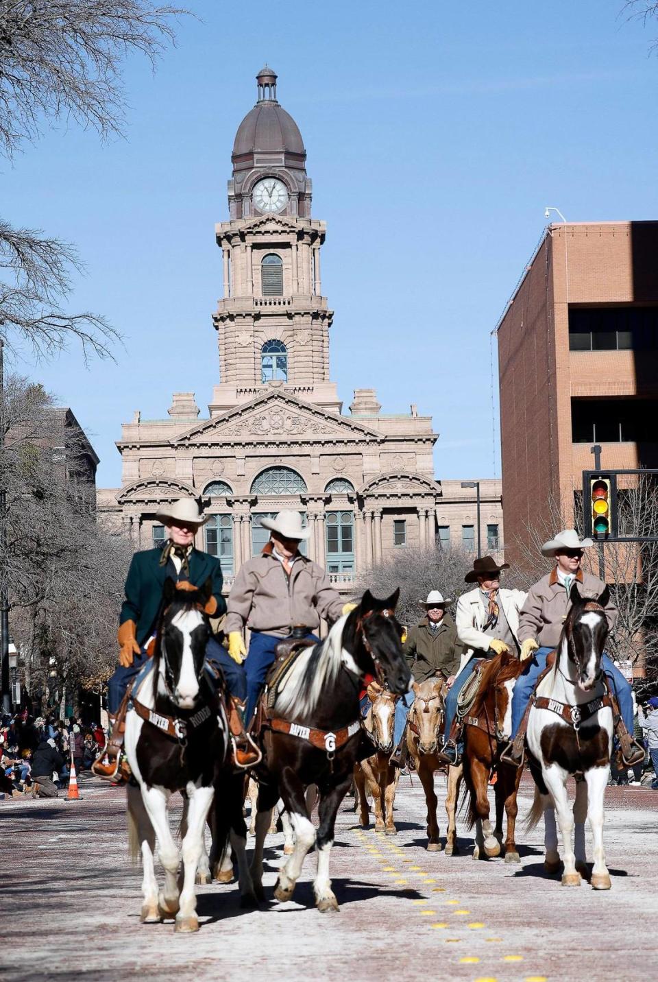 Cowboys head down Main St. during the Fort Worth Stock Show and Rodeo parade in Fort Worth, Texas, Saturday, Jan, 13, 2024. (Special to the Star-Telegram Bob Booth)