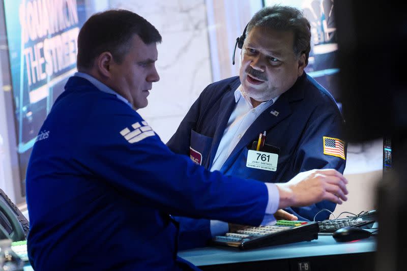 Traders work on the floor of the NYSE in New York