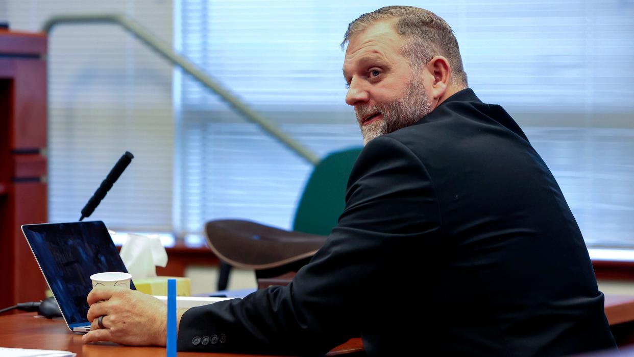 Ammon Bundy glances toward the prosecution table during a pause in his trial to clarify a line of questioning with the jury dismissed in Ada County Magistrate Judge Kim Dale's courtroom on March 15, 2022, in Boise, Idaho. A jury on Monday, July 24, 2023, awarded an Idaho hospital more than $50 million in damages in a defamation case the institution brought against far-right activist Ammon Bundy and others. (Darin Oswald/Idaho Statesman via AP, File)