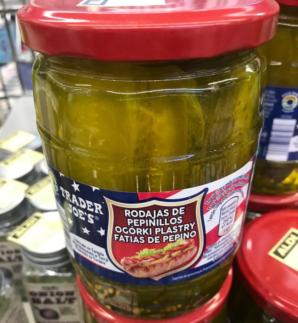 Red and clear jar of pickles with American flag on label at Spanish supermarket